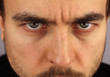 portrait of a man, menacing look, closeup