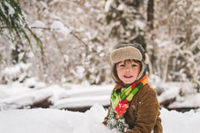 Smiling Boy In Forest In Winter