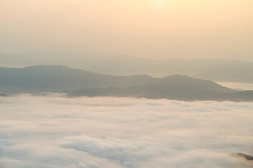 Wall Mural - Sunrise sky and misty layer mountain in the morning at sri nan national park thailand