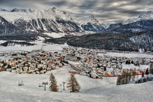 Scenic View Of Snow Covered Town Against Mountain Range