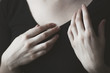 © RooM The Agency - Close-up of woman's hands in front of her chest