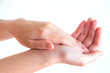 © Chayathorn - handing cream on hand with isolated background