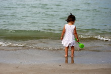 Baby Girl Standing On The Beach, Senigallia, Ancona, Marche, Italy