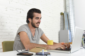 Wall Mural - student preparing exam relaxed or informal hipster style businessman working with laptop computer