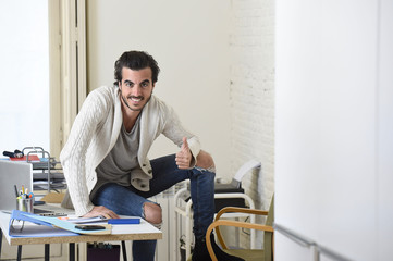 Wall Mural -  handsome student or hipster trendy style businessman wearing battered denim jeans posing corporate