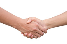 Closeup Of Two Businessmen, Lawyers Or Politicians Shaking Hands To Celebrate A Successful Agreement With One Of Them Holding The Other Hand In His Pocket. Isolated Over White Background.