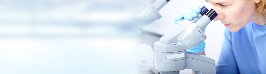 doctor woman working with a microscope.