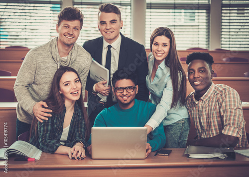 Fotografia, Obraz Multinational group of cheerful students taking an active part in a lesson while sitting in a lecture hall