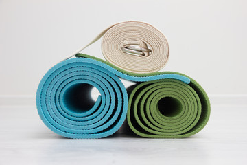 two yoga mats and belt