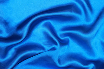 Poster - Curved design on blue silk for pattern and background