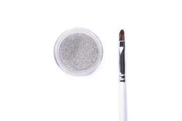 Wall Mural - Top view of silver glitter and make-up brush