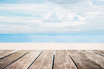 Wall Mural - Wooden terrace with the beach view in summer