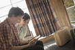 © Mint Images - A young couple in a motel room,