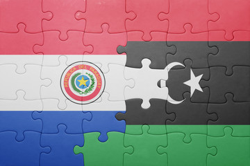 puzzle with the national flag of paraguay and libya