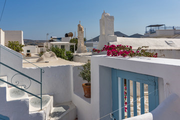 Small white church with flowers in town of Parakia, Paros island, Cyclades, Greece