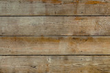 Fototapeta Desenie - Natural wooden brown and rusty boards, wall or fence with knots and nails. Abstract texture background, empty template