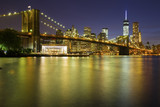 Fototapeta  - Brooklyn Bridge at dusk viewed from the Brooklyn Bridge Park in New York City.