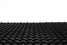 Abstract Row of black brick roof on clear sky background