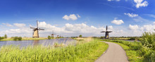 Traditional Dutch Windmills On A Sunny Day At The Kinderdijk