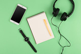 Fototapeta Do pokoju - Smartphone, notepad, headphones, pen and watch