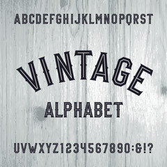 Poster - Vintage style alphabet vector font. Letters and numbers on the light wooden background. Retro vector typeface for labels, flyers, headlines, posters etc.