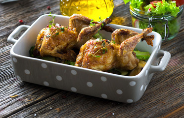 Wall Mural - Roasted quail with vegetable on wooden background