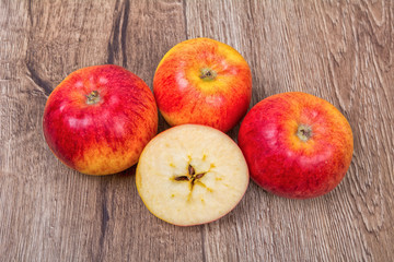 Ripe apples on a wooden background