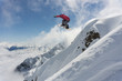 © Vasily Merkushev - Snowboarder making jump, extreme mountain freeride.