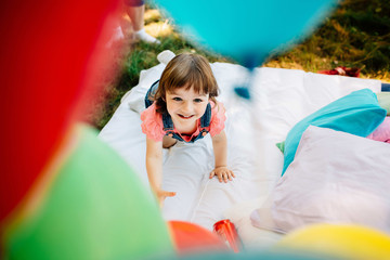 Wall Mural - Little girl having fun outdoors in park.