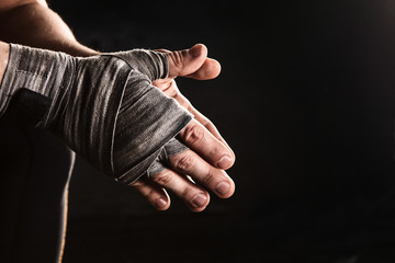 close-up hand of muscular man with bandage