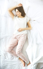 Wall Mural - Beautiful young girl sleeping in the bedroom.