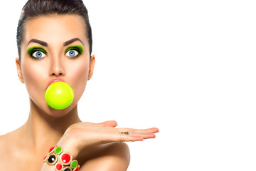 Wall Mural - fashion funny model girl with green bubble of chewing gum