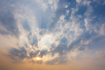 Wall Mural - sunset sky with rays of light shining down pass clouds and sky