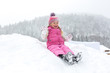 © bigguns - little girl happily playing in the snow