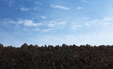 cross section of soil surface over the sky with copy space