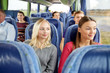 © Syda Productions - happy young women riding in travel bus