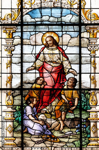 Fototapeta na wymiar Jesus friend of the children, stained glass window in the Basilica of the Sacred Heart of Jesus in Zagreb, Croatia