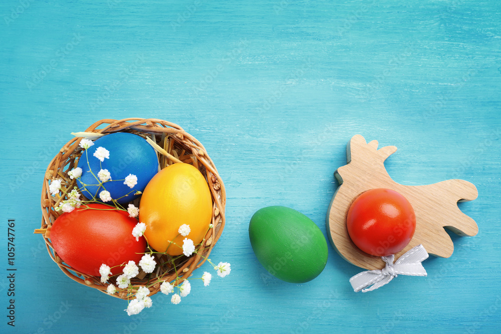 Easter eggs in a wicker basket, top view