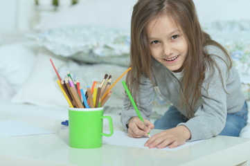 Wall Mural - little girl drawing at home