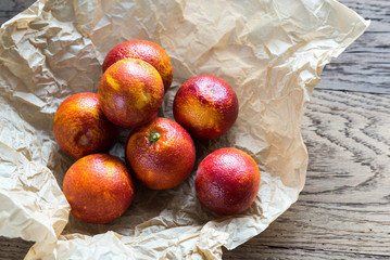 Canvas Print - Red tangerines on the wooden background