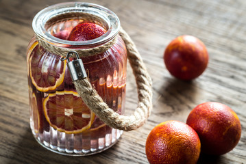 Wall Mural - Red tangerines on the wooden background