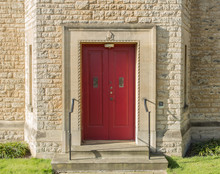 Red Door With Crest Above