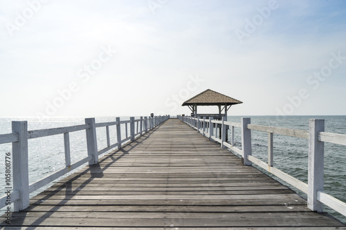 Naklejka na drzwi The wooden bridge walkway into the sea.