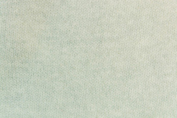 The white woolen fabric closeup with patterns