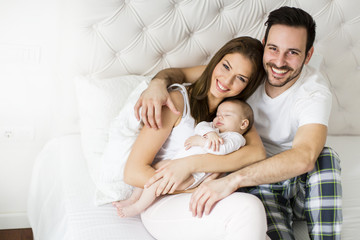 Happy family with newborn baby