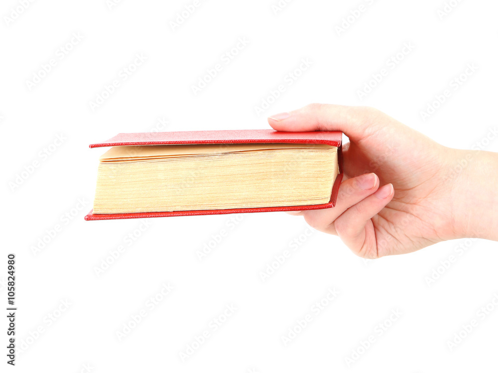 Female hand holding book, isolated on white