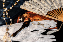 Theater Accessories: Fan, Eyeglasses, Gloves, Jewelry.