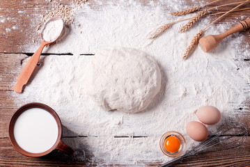 dough with flour and ingredients on the table