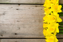 Yellow Daffodils On Wooden Table
