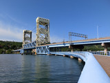 Fototapeta Uliczki - Houghton, Michigan drawbridge across river - landscape color photo